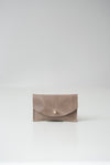 front view of the glare card holder in beige veg tan leather