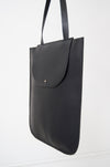 front view of the dawn oversized tote in black Horween essex veg tan leather