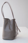 front view of the small aura in taupe pebbled leather