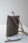 Front view of the Small Ray Backpack in taupe pebbled leather